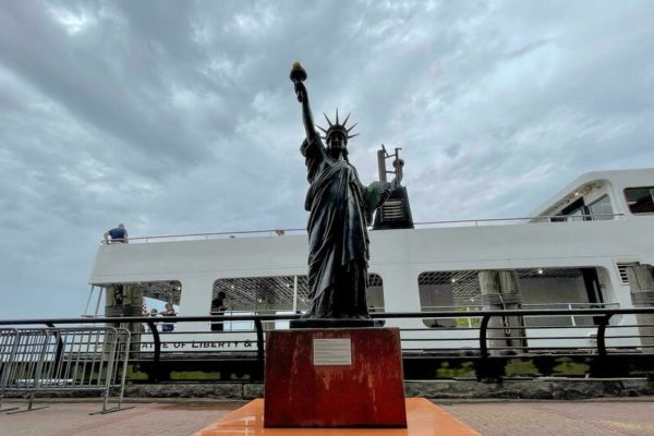 Mini Statue of Liberty, on loan from France, joins the original in New York Harbor